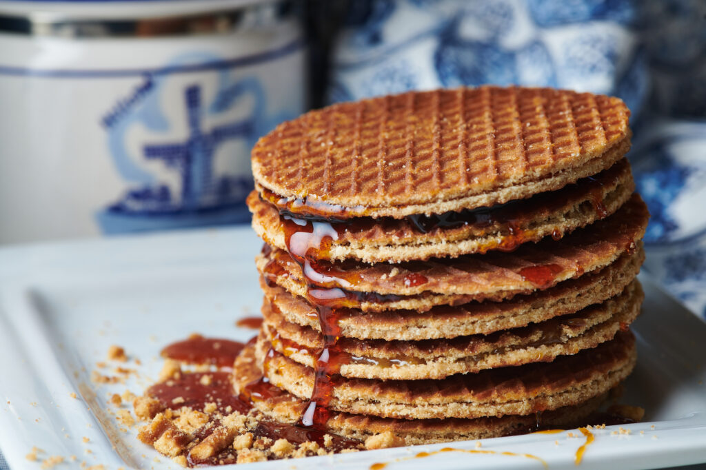 A stroopwafel (literally "syrup waffle") is a wafer cookie made from two thin layers of baked dough joined by a caramel filling.